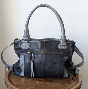 Muxo By Camila Alves Black/Gray Leather Fringe Logo Handbag Purse